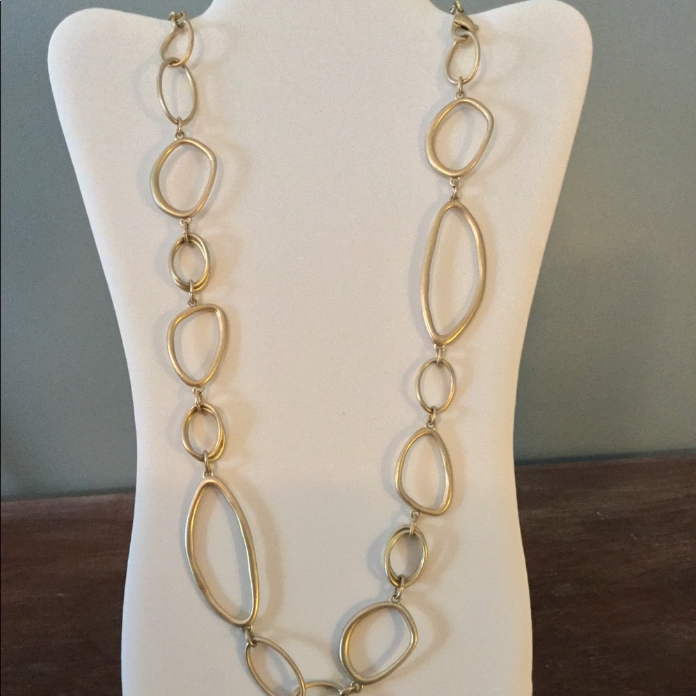 Matte gold abstract design necklace.